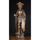 A Fine 16th Century Brussels Carving of Man wearing a plumed hat and cloak over armour,