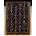 A 16th Century Oak Panel carved with elaborate Gothic tracery, 11 ins x 8¼ ins (28 cm x 21 cms).
