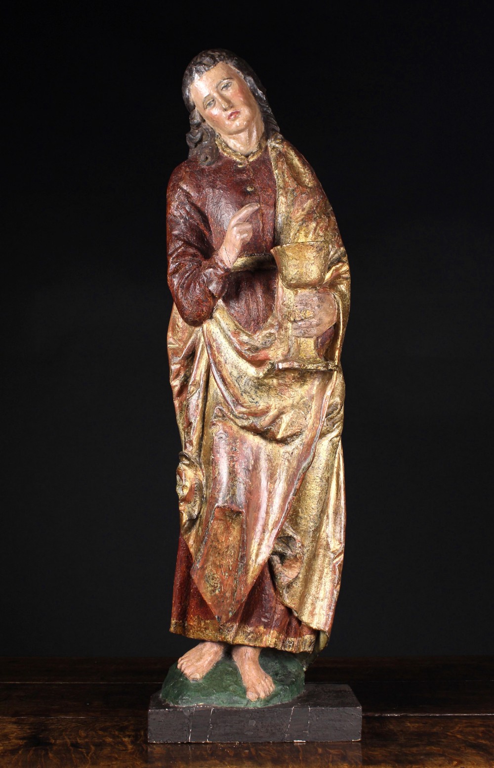 A Late 15th Century Polychromed Northern French Carving of Saint John.