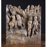 A 16th Century Flemish Oak Retable Carving of a horseman and figures below a townscape,