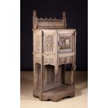 A 15th Century French Gothic Oak Dressoir intricately carved with elaborate tracery decoration.