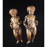 A Pair of 18th Century Flemish Carved Oak Putti with ribbons tied around their waists and serpents