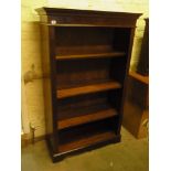 A modern mahogany effect bookcase with a