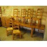 A French style oak kitchen table with tw