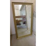 A modern gilt mirror - 1.34 m x 73 cm