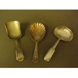 A collection of three silver caddy spoon