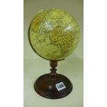 A terrestrial Desk Globe on a mahogany b