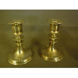 A pair of silver dwarf candlesticks with