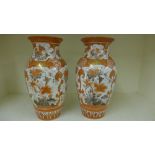 A large pair of Kutani baluster vases de