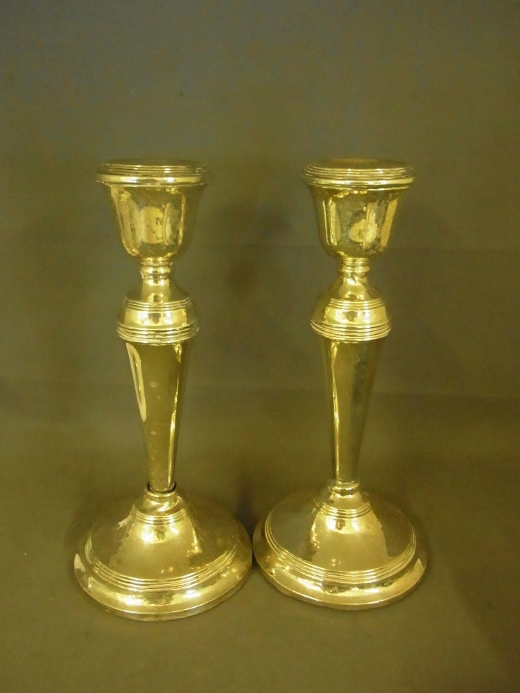 A pair of hallmarked silver candlesticks