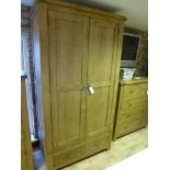 An oak double wardrobe W 107cm x D 57cm