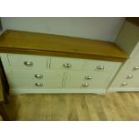 A painted seven drawer wide chest W 152c