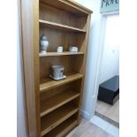 A tall oak bookcase Width 96cm x D 32cm