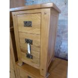 An oak three drawer bedside W 45cm x D 4