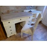 A farmhouse style nine drawer desk with