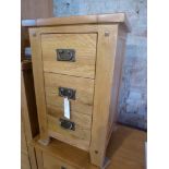 An oak three drawer bedside W 45cm x D 4