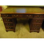 A mahogany nine drawer twin pedestal des