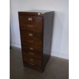 A vintage four drawer filing cabinet wit