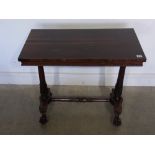 A late Regency rosewood stretcher table