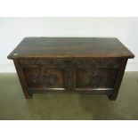 An 18th century carved oak coffer - Heig