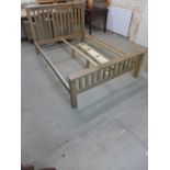 An oak 4'6" bed