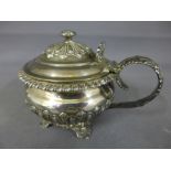 An oversize silver condiment with a gilt