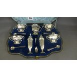 A boxed silver seven piece cruet set - L