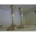 A pair of hallmarked silver candlesticks