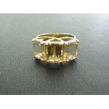 A 9ct gold morganite three-stone ring -