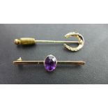 A 9ct gold and amethyst bar brooch, a 9c