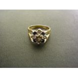 A 9ct gold diamond and sapphire cluster