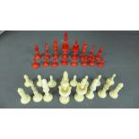 A set of bone and red stained Chessmen i