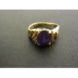 An amethyst and diamond ring - Stamped 5