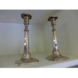 A pair of Sterling silver candlesticks w