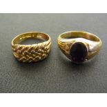 A 9ct gold woven style ring - Hallmarked