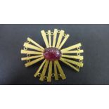 An 18ct gold ruby cabochon abstract open