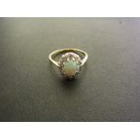 An opal and diamond cluster ring - The o