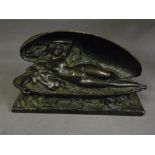 A bronze group of a naked woman with che