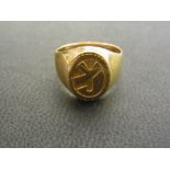 An 18ct gold signet ring - With foreign