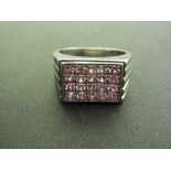 An 18ct gold pink sapphire panel ring -