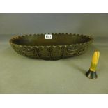 A carved oval ebony bowl with deep cut d