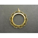 A 9ct gold Sovereign pendant surround -