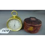 A pocket aneroid barometer with thermome