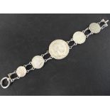 A Victorian silver coin bracelet with a