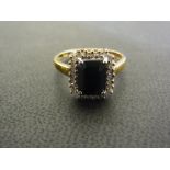 A 9ct gold sapphire and diamond cluster