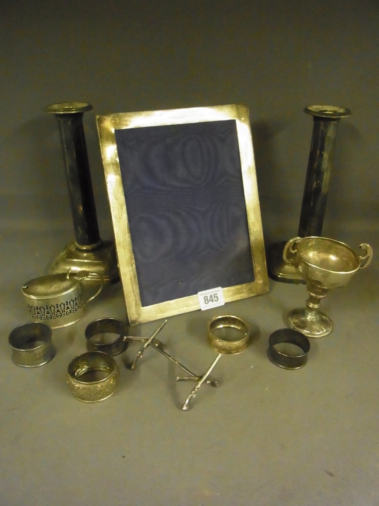 A silver photo frame, a pair of silver w