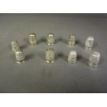 A collection of nine silver thimbles by