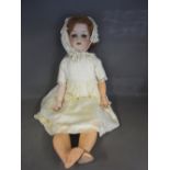 A 1916 Bergman Girl Doll with rolling ey