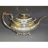 A late George III silver teapot with emb