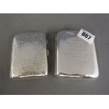 Two silvered cigarette cases - one with